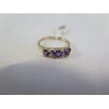 A hallmarked 9ct yellow gold amethyst and diamond ring, size O, approx 1.6 grams - new condition, ex