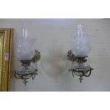 A good pair of Victorian brass bracket wall oil lamps with replacement etched shades, 36cm long,