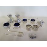 Two pairs of silver salts, a silver mustard, a pair of weighted silver dwarf candlesticks, a