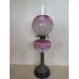 An oil lamp with an etched shade and pink glass font, 67cm tall, generally good, small chips to