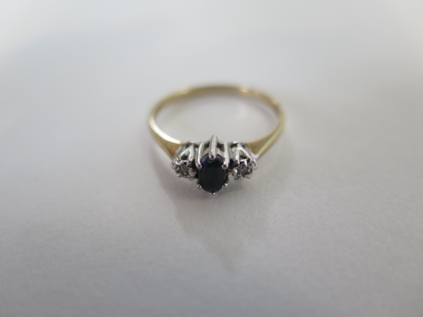 A 9ct yellow gold sapphire and diamond ring, size N, hallmarked, generally good condition, approx