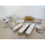 A silver ten piece dressing table set, assorted makers and dates, general wear and denting, foot