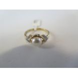 A hallmarked 9ct yellow gold pearl and diamond ring, size O - approx 2.2 grams, new condition, ex