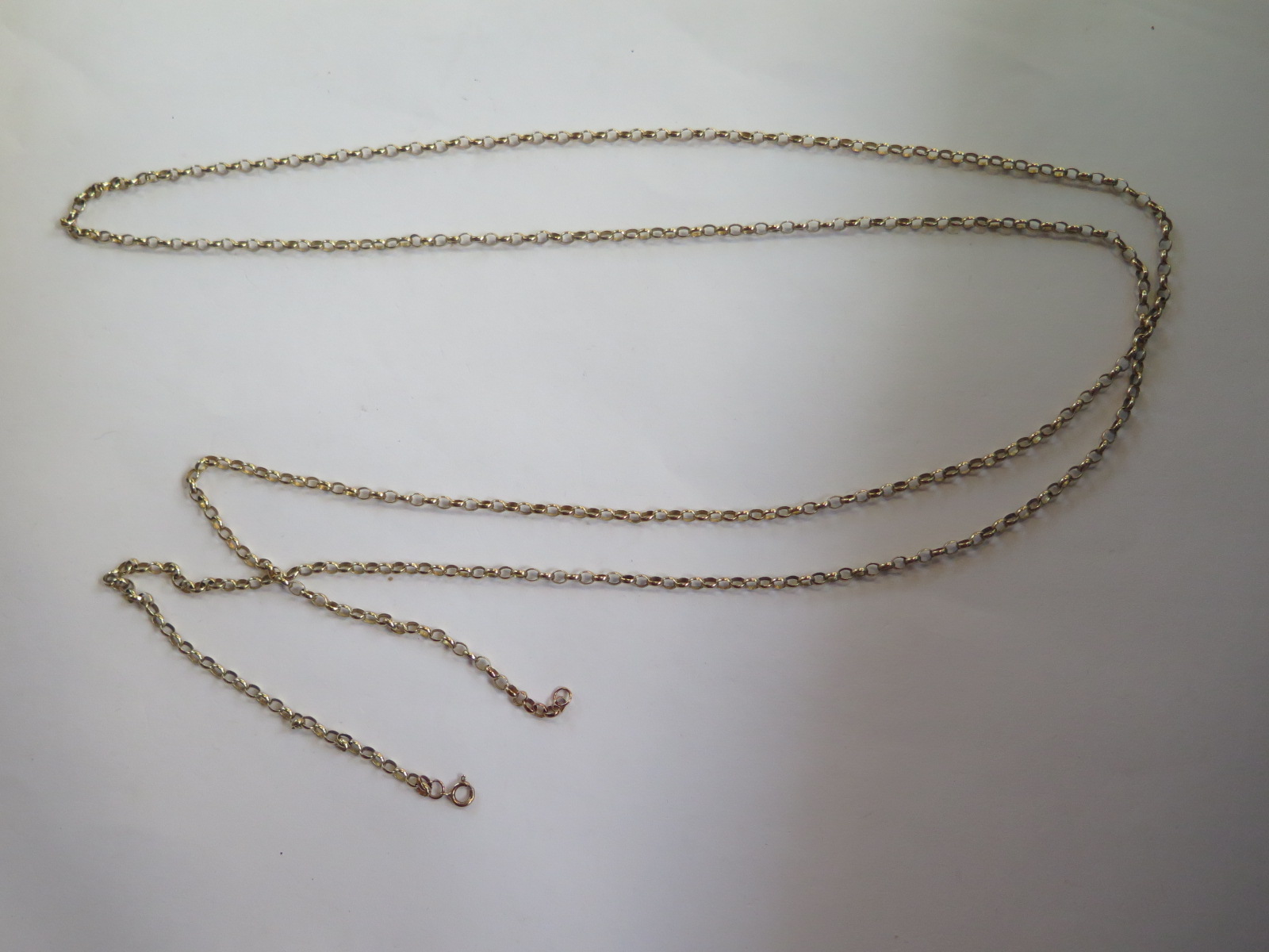 A 9ct yellow gold long chain - 146cm long, approx weight 24.3 grams, in good condition, marked 9ct