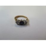 An 18ct hallmarked yellow gold sapphire and diamond illusion set ring - size G/H - total weight