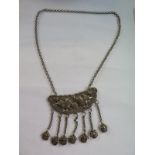 An Oriental white metal pendant necklace, 43cm in length- good condition