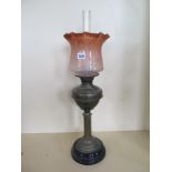 An oil lamp with etched tinted shade, overall condition good, 68cm tall