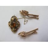 An ornate brooch, tests to approx 9ct, total weight approx 7.9 grams - 5 x 3.5cm - some small