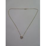 A 9ct gold heart pendant necklace, marked 9K, approx 1.9 grams - ex jewellers stock, new condition