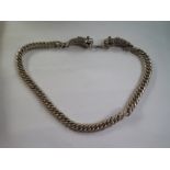 An oriental white metal dragon necklace, 66cm long - good condition