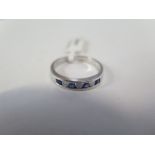 A hallmarked 9ct white gold sapphire ring, size M, approx 2 grams, new condition, ex jewellers stock