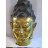 A gilt bronze Chinese Buddha head, 34cm tall, no obvious damage, with aged finish