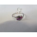 A hallmarked 9ct white gold diamond and ruby ring, size P - approx 2 grams - new condition, ex