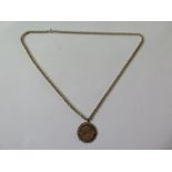 A George V full gold sovereign in a hallmarked 9ct mount, on a hallmarked 9ct chain, length 30cm,