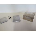 Two silver cigarette cases, a silver cheroot holder case and silver desk box, weigh-able silver