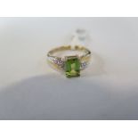 A hallmarked 9ct yellow gold peridot and diamond ring, size L, approx 2.3 grams - new condition,