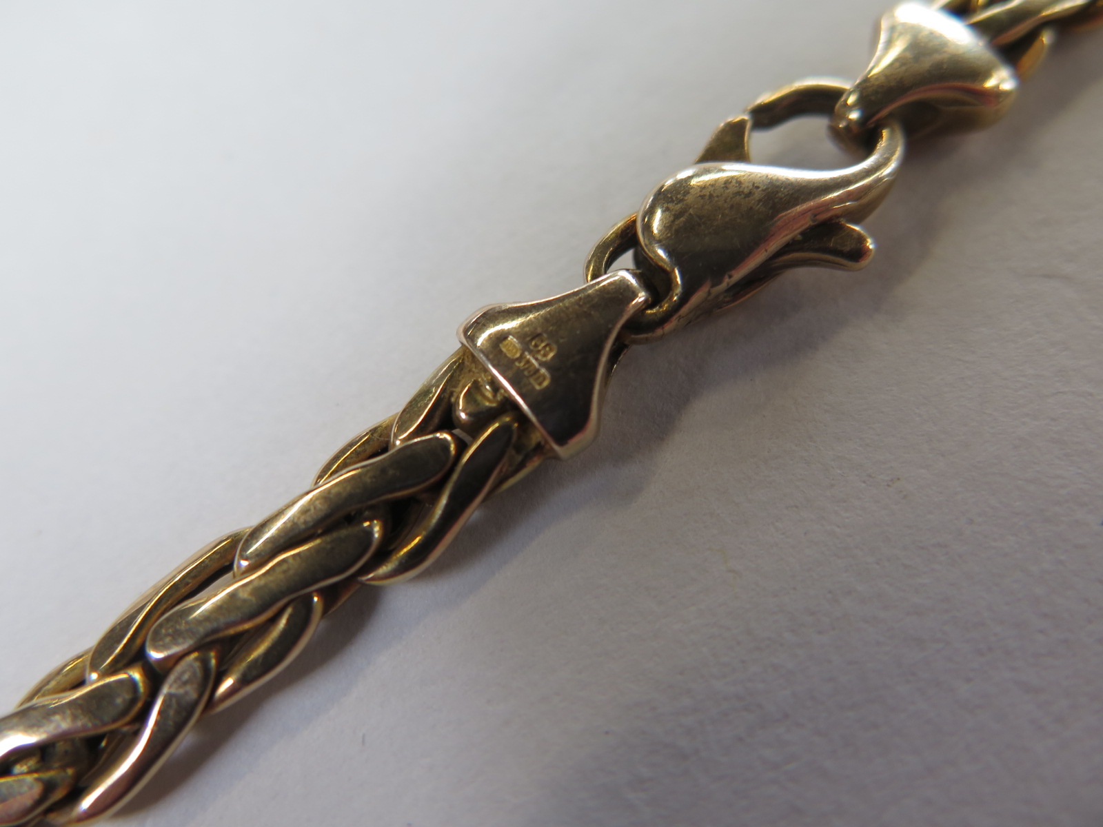 A plaited 9 carat gold necklace, approximately 42.5 cm long, with some signs of wear to clasp, - Image 2 of 2