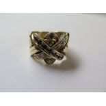 A diamond and Sapphire crossover ring possibly American ,tests to approximately 14 carat, ring