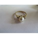 A hallmarked 9ct yellow gold pearl and diamond ring - size P, approx 3.5 grams - pearl 7x8mm