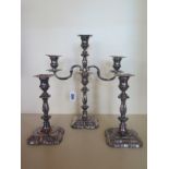 A silver Roberts & Bell three branch candelabra 30.5cm high, with pair of candlesticks, all