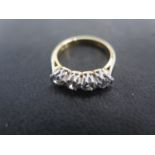 An 18ct yellow gold four stone diamond ring size H/I - approx weight 2.9 grams - total diamond