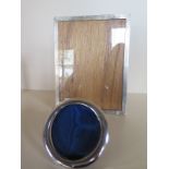 Two silver photo frames, largest 26cm x 20cm, minor dents to both