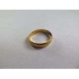 A 22ct gold hallmarked band ring, size R, approx 3.5 grams - some usage marks but generally good