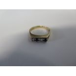 A 9ct yellow gold diamond and sapphire hallmarked ring - Size N approx 2.8 grams, generally good,