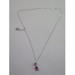 A 9ct white gold pink topaz necklace pendant, 2m long, marked 375 approx 2 grams - ex jewellers, new