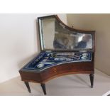 A 19th Century musical sewing case in the form of a harpsichord, with a mirror fitted interior,