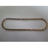 A plaited 9 carat gold necklace, approximately 42.5 cm long, with some signs of wear to clasp,