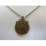 A Napoleon III, 22 carat gold, 20 Franc coin pendant necklace with a chain stamped 9ct, the coin