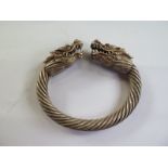 An oriental white metal dragon bangle, 10x9cm - good condition