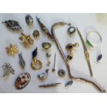 A small quantity of assorted costume jewellery including a white metal dagger brooch