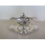 A silver twin handled sauce boat on stand, Chester 1906/07 maker HEB FEB, approx 6.5 troy oz,