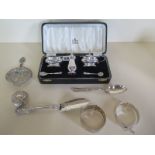 A boxed silver cruet set, two pieces of silver pot, two silver bangles and a white metal adapted