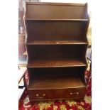 A 20th century mahogany waterfall front bookcase