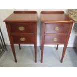 A pair of rosewood lamp tables each with two drawers