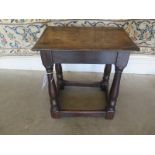 an antique oak stool - 47cm tall x 43cm x 28cm