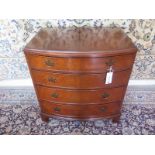 A 20th Century Bevan Funnell walnut bow front four drawer chest 83cm tall x 78cm x 53cm - in good