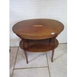 An Edwardian two tier inlaid oval table - 69cm tall x 68cm x 43cm