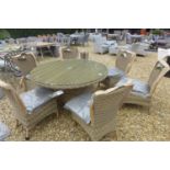 A Bramblecrest Foxham 140cm all weather wicker round table with four side chairs and cushions