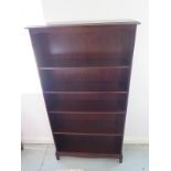 A tall 'stag' mahogany open bookcase 170cm H x 79cm x 25cm - in good clean polished condition