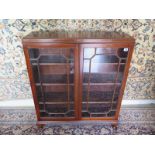 An Edwardian mahogany glazed cabinet book case with adjustable shelves - 105cm H x 89cm x 25cm -
