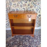 A yew wood bookcase with two frieze drawers 83cm H x 76cm x 30cm - in good clean polished condition