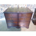 A modern mahogany effect four drawer filing cabinet with a leather inset top 76 cm tall 94 cm x 61