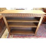 A 1930's oak bookcase with two shelves, in good condition - 107cm W x 90cm H