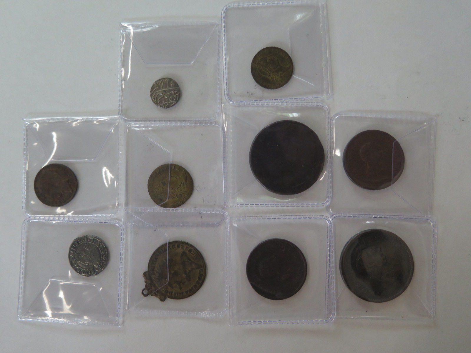 Four Georgian coins, pennies and halfpennies together with a small collection of tokens