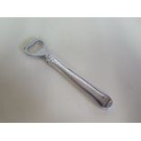 A Georg Jensen silver handled bottle opener - 15cm long - generally good