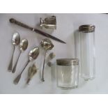 A collection of silver items including a Georgian tea spoon, silver lidded dressing table bottles, a